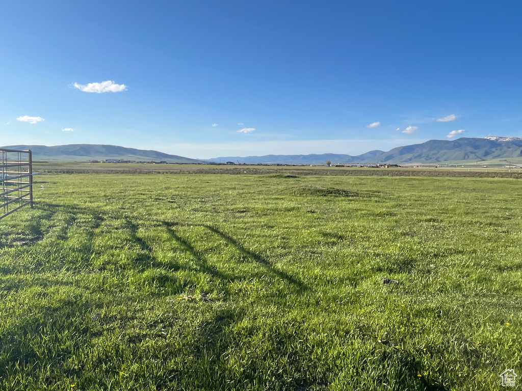View of mountain backdrop with rural landscape