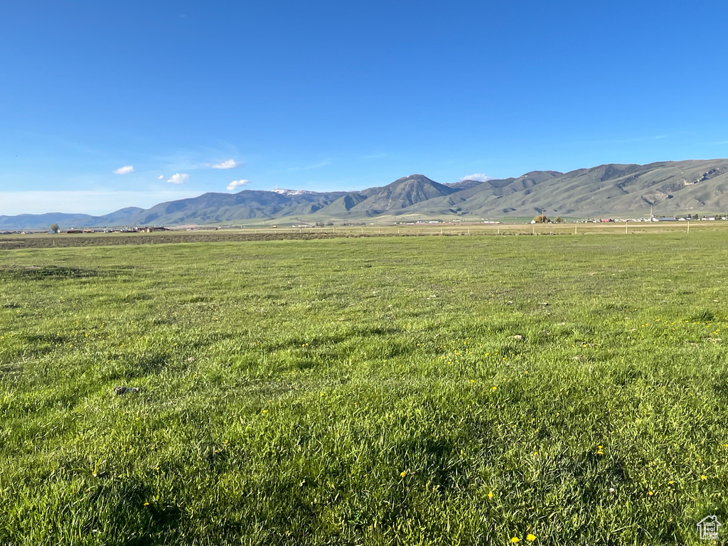 View of mountain background featuring rural landscape