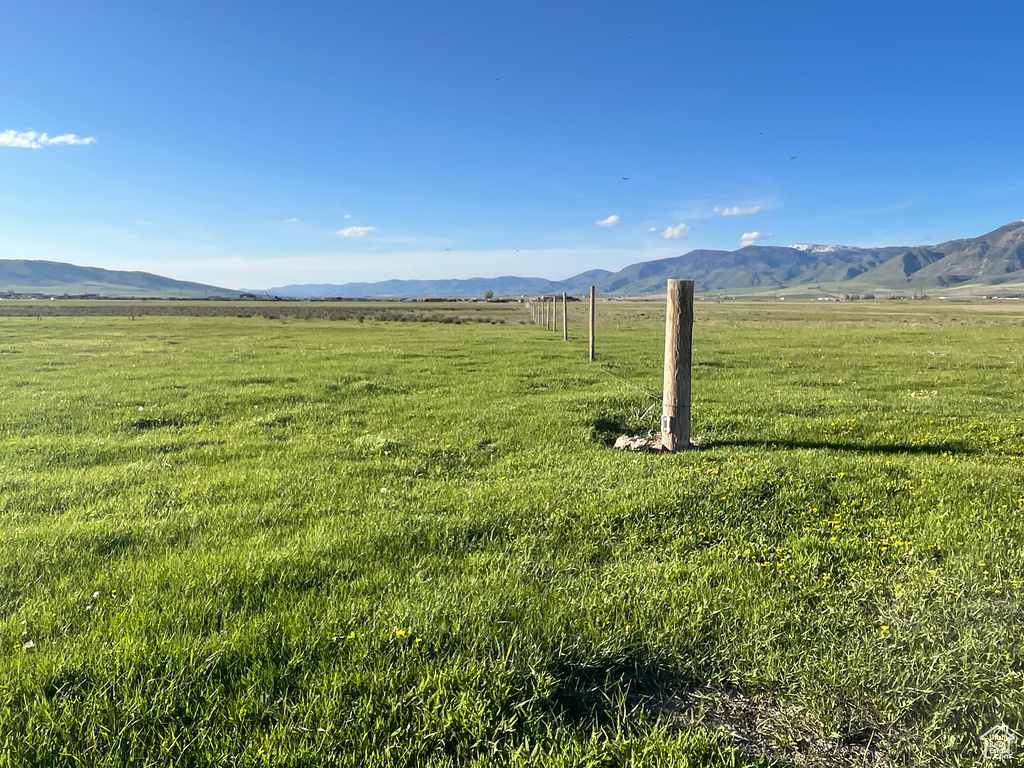 View of mountain backdrop featuring rural landscape and agricultural land