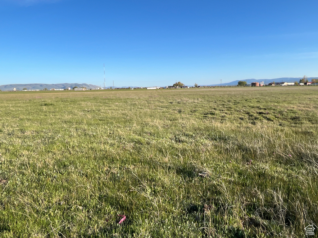 View of undeveloped land featuring rural landscape and mountains