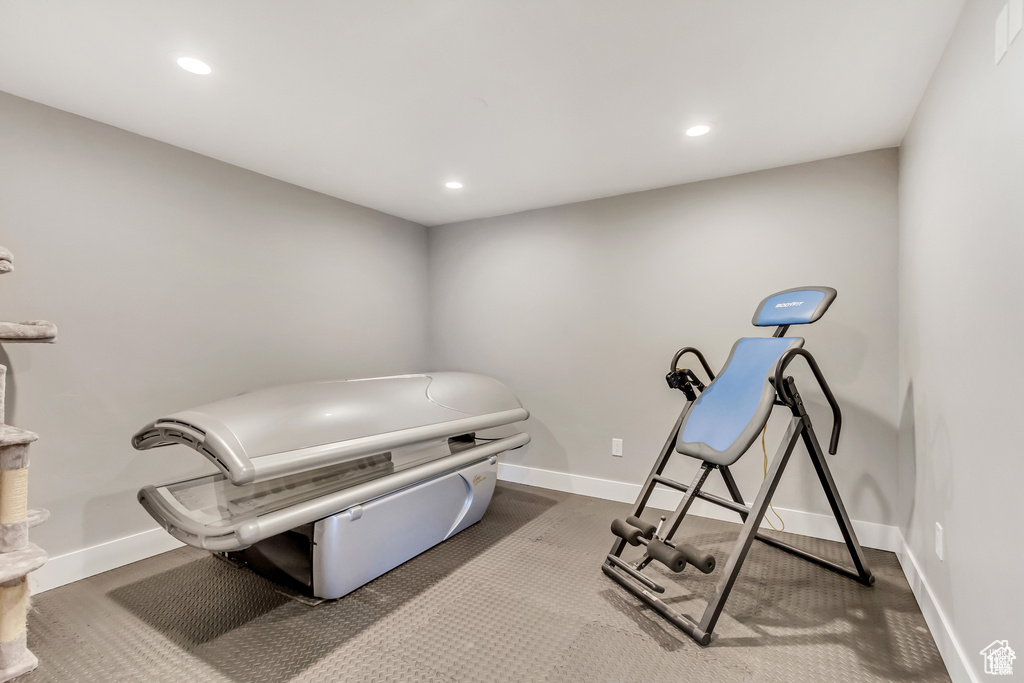 Workout room with baseboards and recessed lighting
