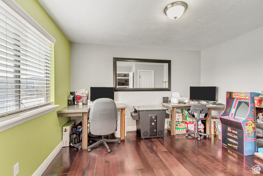 Office area featuring wood finished floors and baseboards