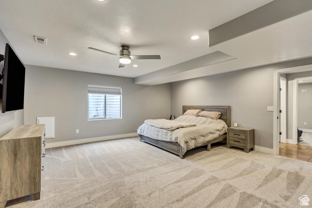 Bedroom with light carpet, baseboards, recessed lighting, and ceiling fan