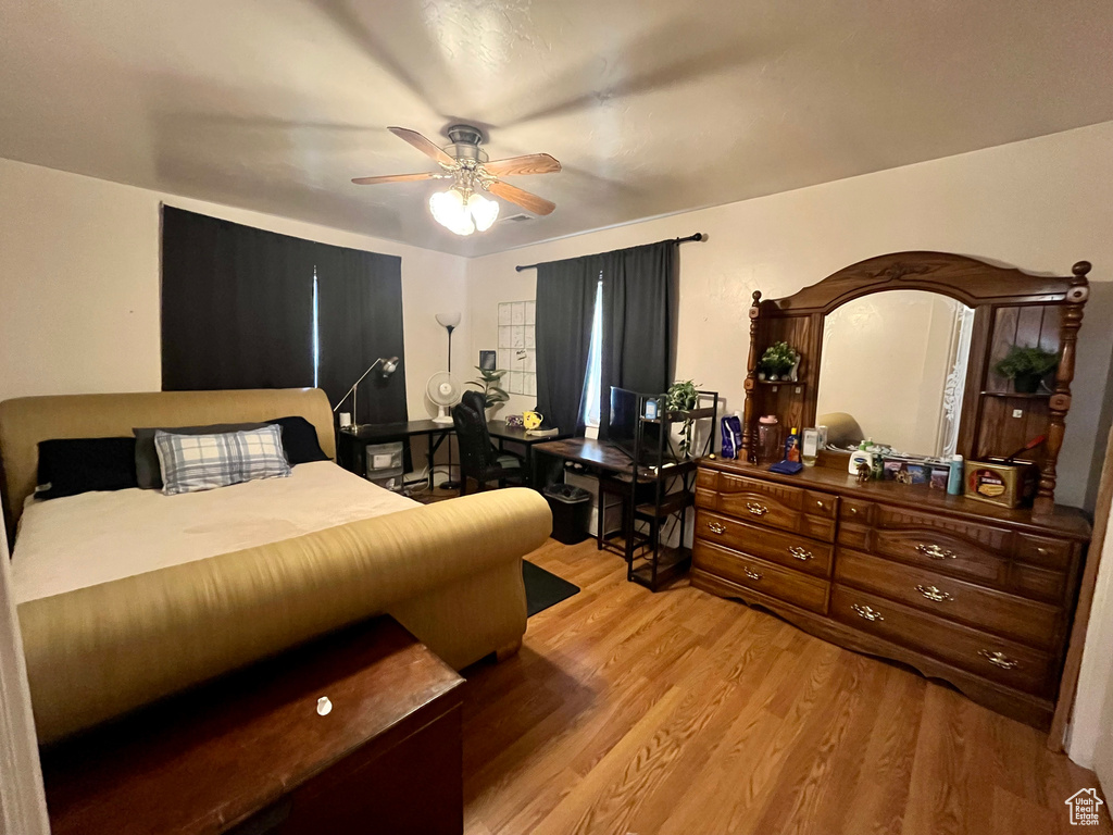 Bedroom featuring light wood-style floors and a ceiling fan