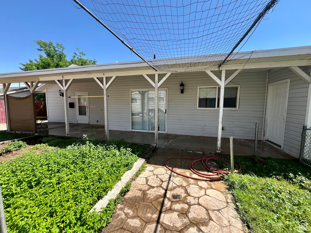Back of property with a patio