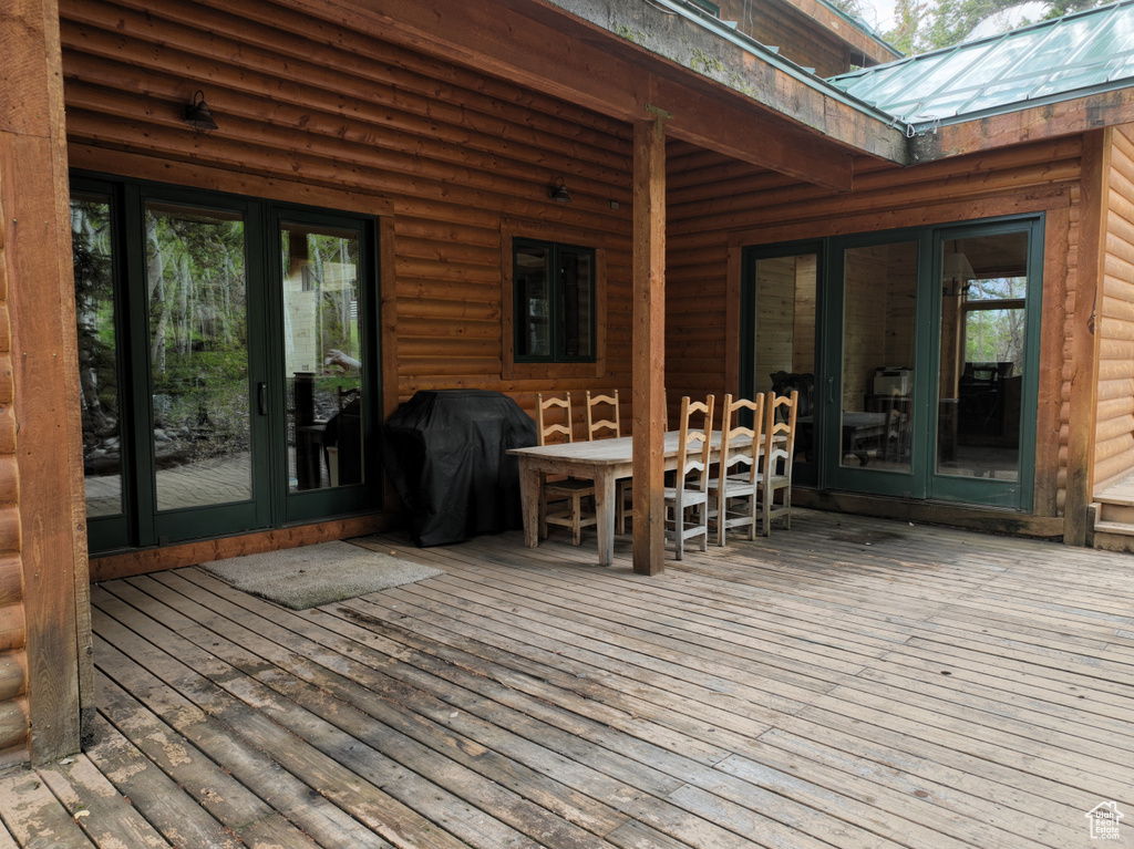 Deck featuring area for grilling and french doors