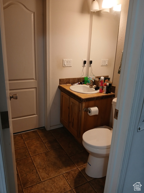 Bathroom featuring vanity and tile patterned flooring