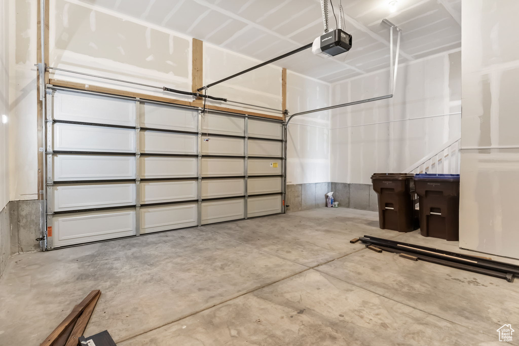 Garage featuring a garage door opener