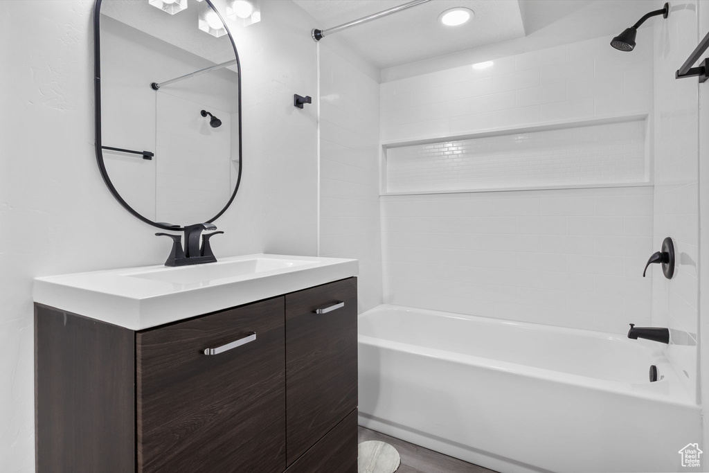 Bathroom featuring shower / tub combination and vanity