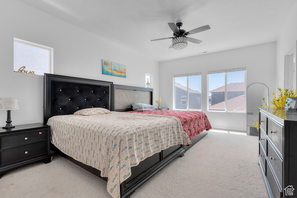 Bedroom featuring carpet flooring and ceiling fan