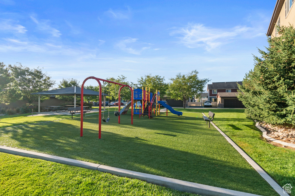 Community playground featuring a lawn