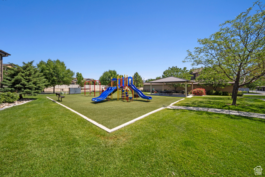 Community play area featuring a lawn and a gazebo
