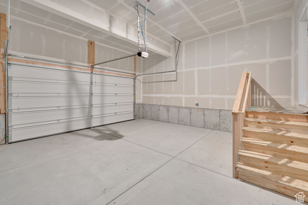 Garage featuring a garage door opener