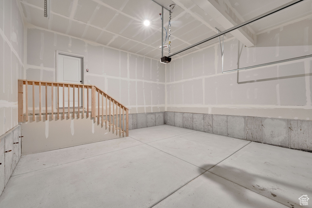 Garage featuring a garage door opener