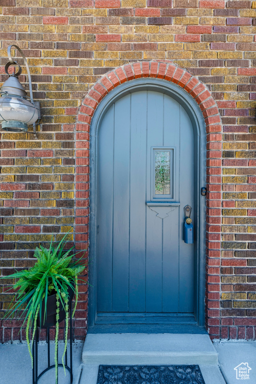 Property entrance with brick siding