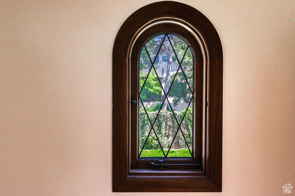 Detailed view of arched walkways and stucco siding