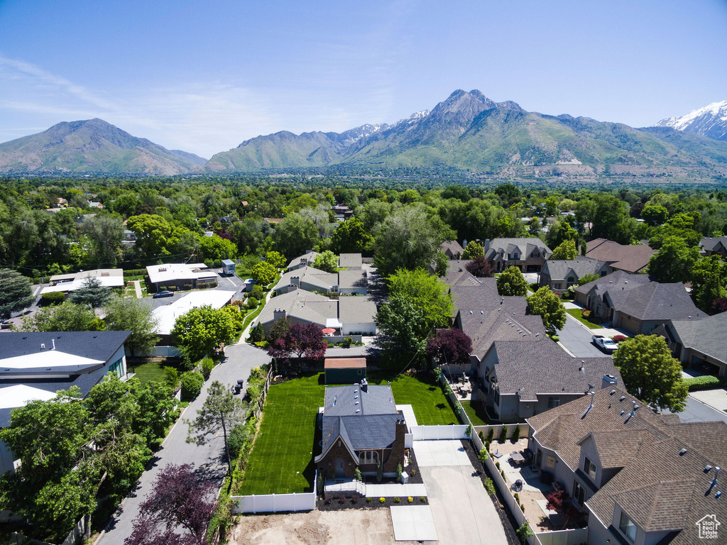 Aerial perspective of suburban area featuring a mountain backdrop