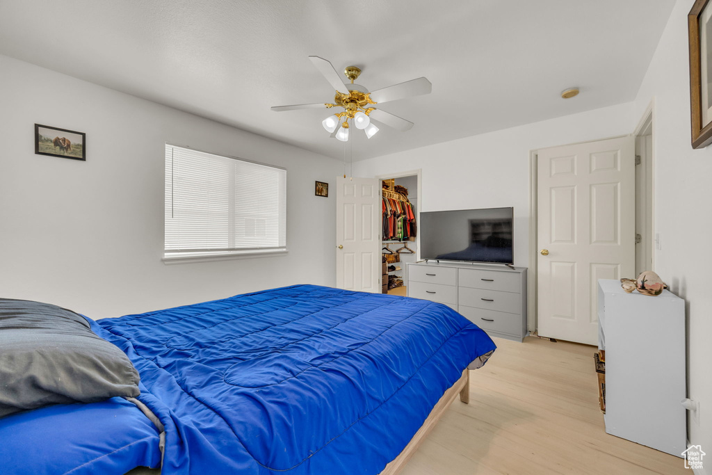 Bedroom with light wood-type flooring and ceiling fan