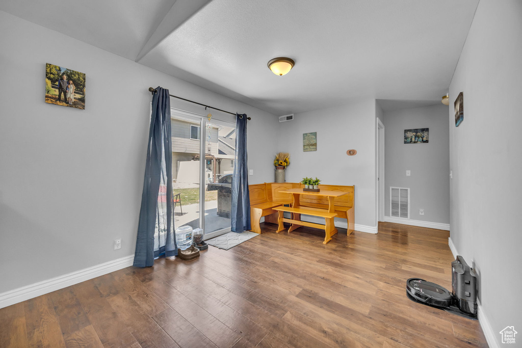 Interior space with wood finished floors and baseboards