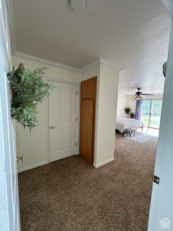 Unfurnished bedroom featuring carpet, baseboards, and ornamental molding