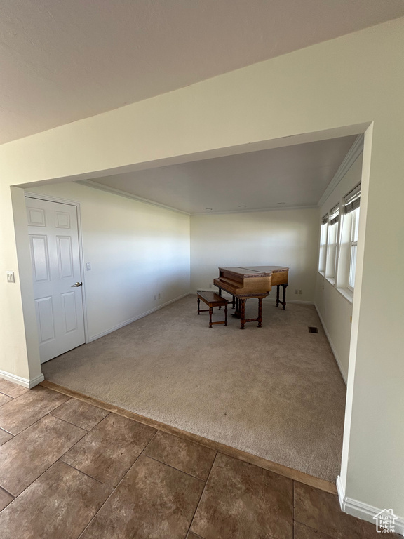 Carpeted dining area with baseboards