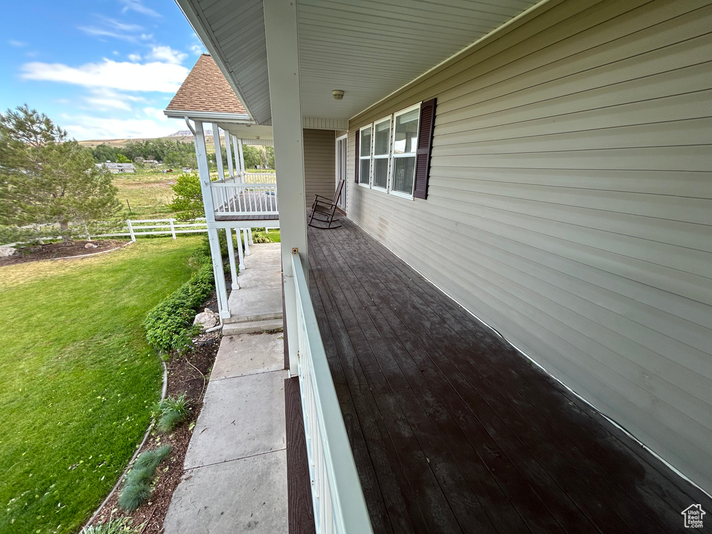 View of side of home with a porch
