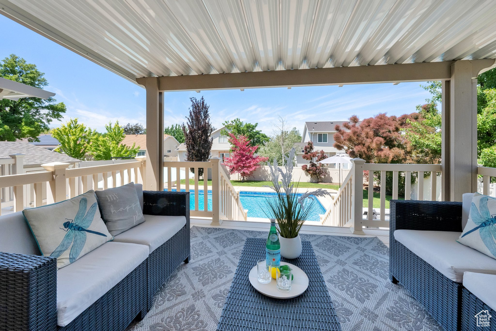 Deck with outdoor lounge area and a residential view