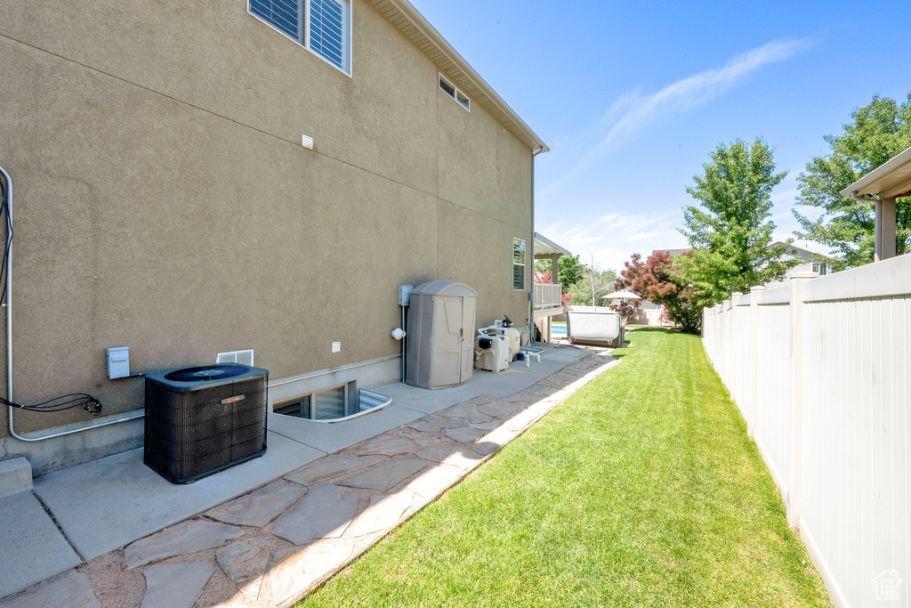 View of yard with a patio area and cooling unit