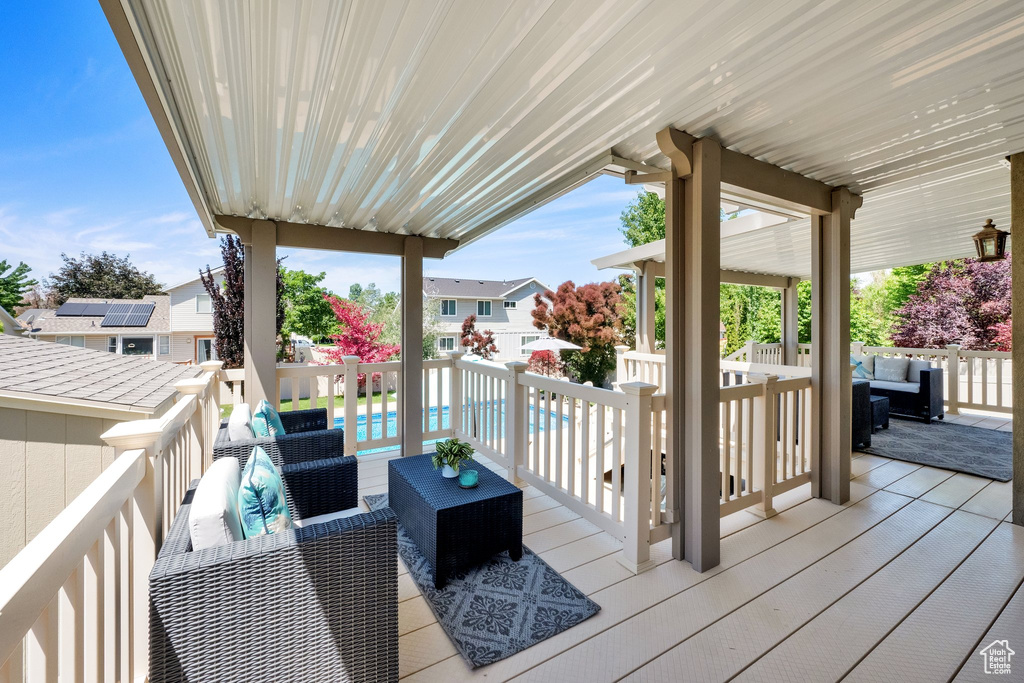 Wooden deck featuring an outdoor hangout area