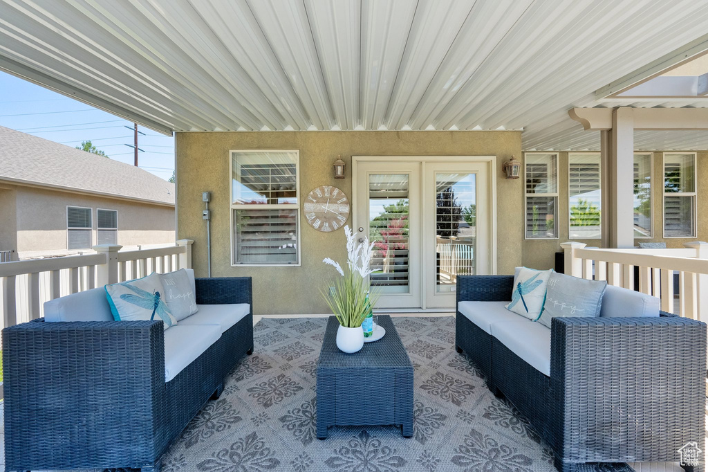 View of patio with an outdoor hangout area