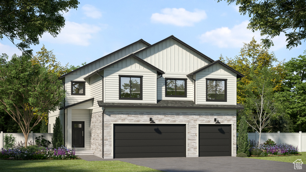 View of front of home featuring an attached garage, board and batten siding, and driveway