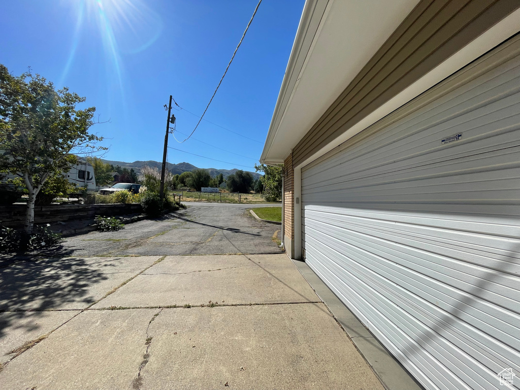 View of side of property featuring a mountain view