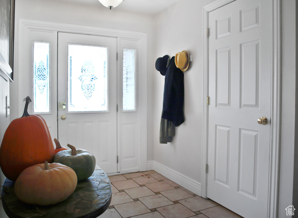 Entrance foyer featuring baseboards