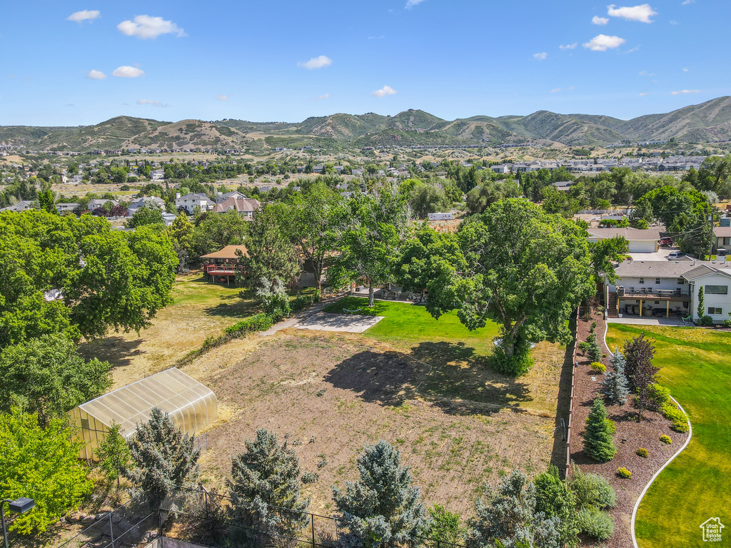 Aerial perspective of suburban area with a mountain backdrop