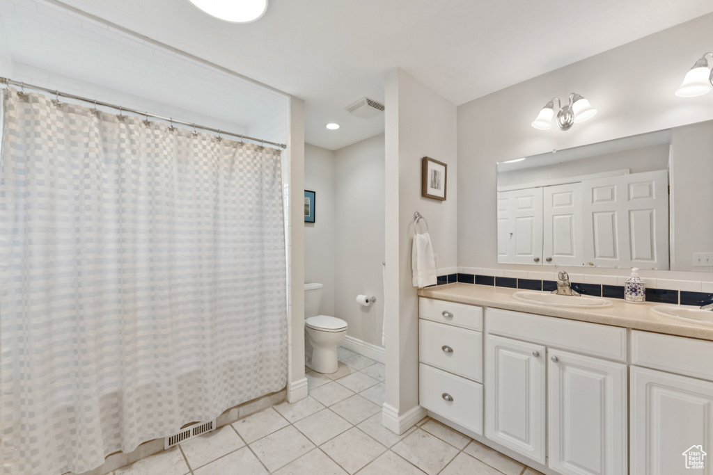 Full bath with double vanity, tile patterned flooring, a shower with curtain, and recessed lighting