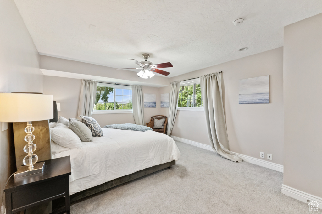 Bedroom with carpet floors and ceiling fan