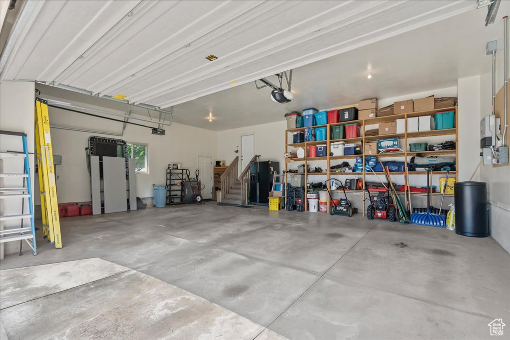 Garage featuring a garage door opener