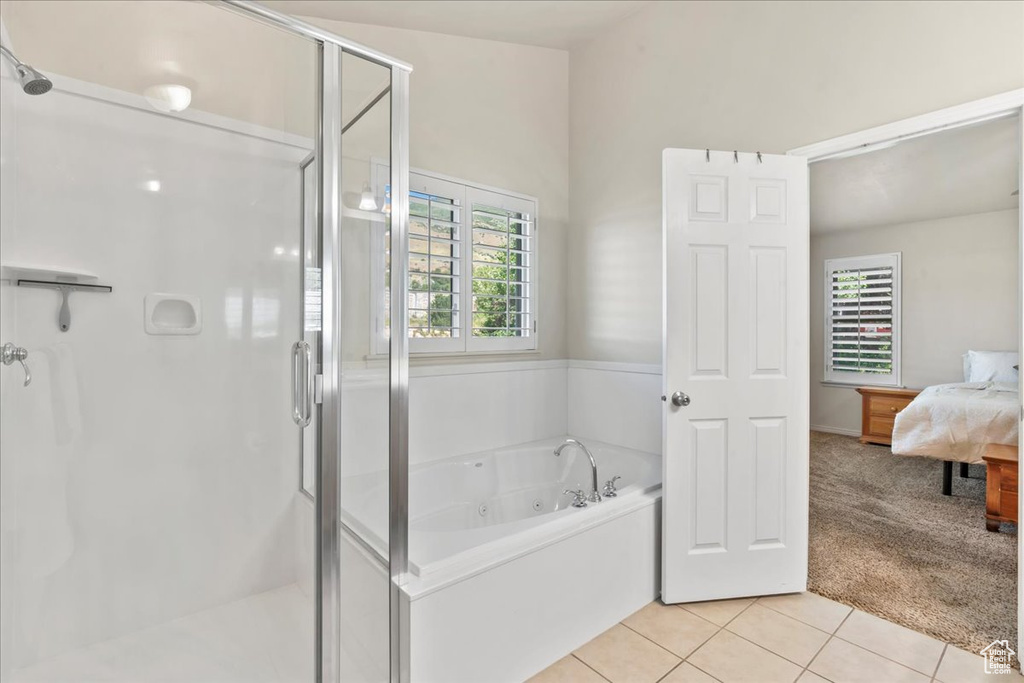 Ensuite bathroom with a shower stall, a jetted tub, and tile patterned flooring
