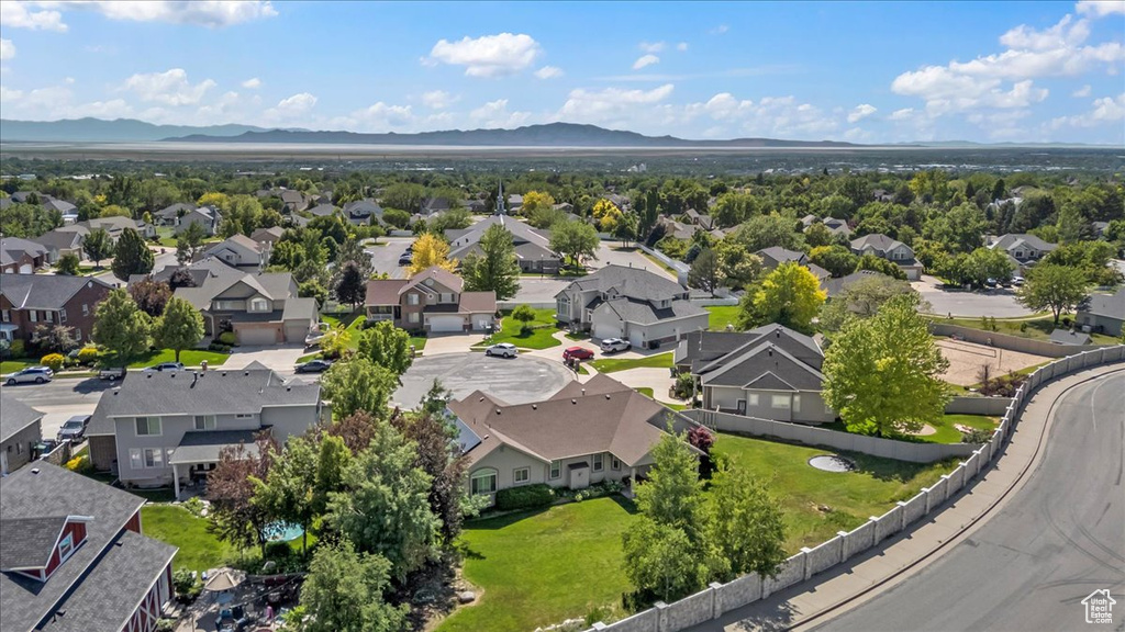Aerial view of residential area with a mountainous background