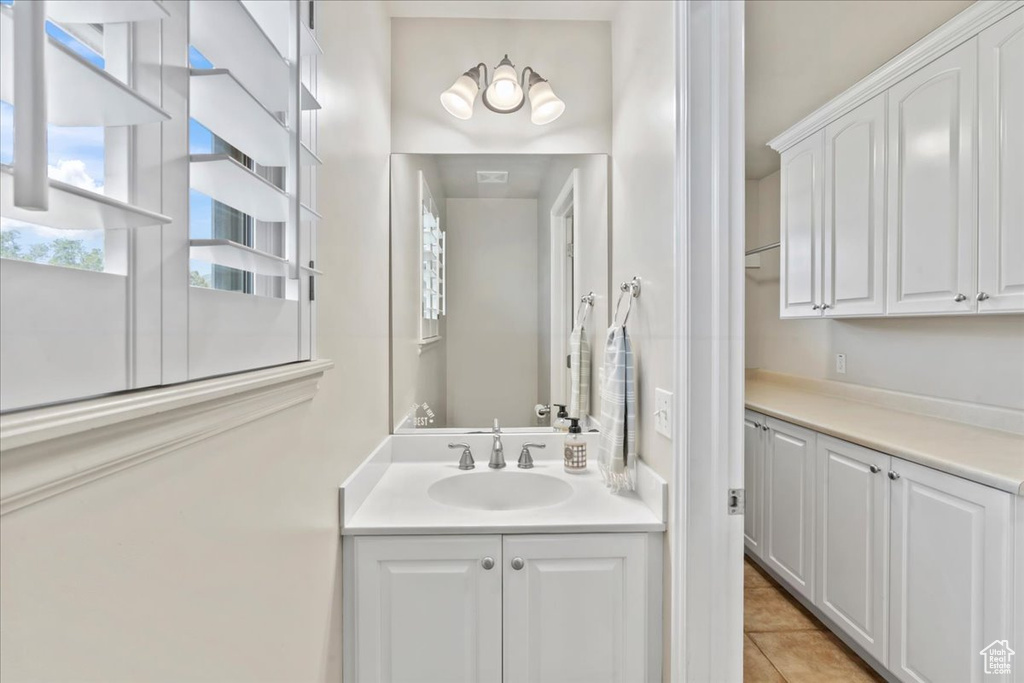 Bathroom with vanity and tile patterned flooring