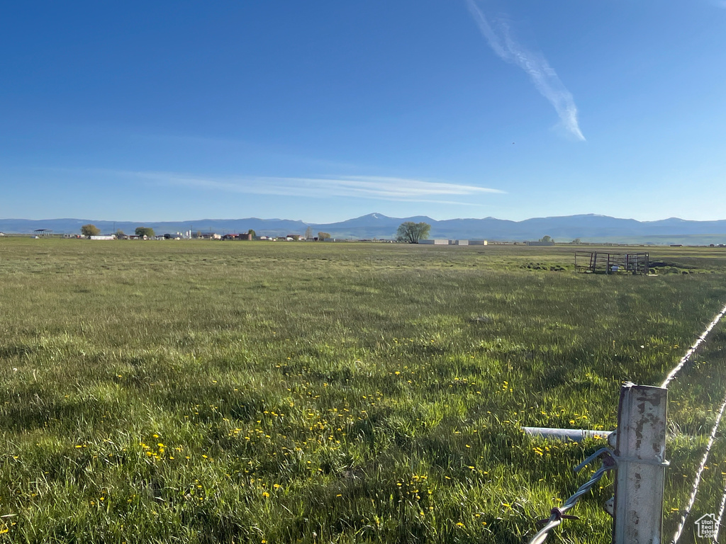 View of mountain backdrop featuring rural landscape