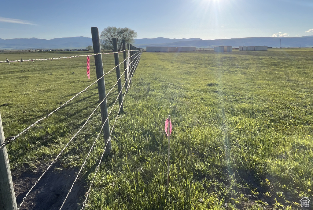 View of yard featuring a rural view and a mountain view