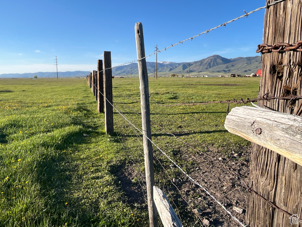 View of mountain backdrop featuring rural landscape and a pastoral area