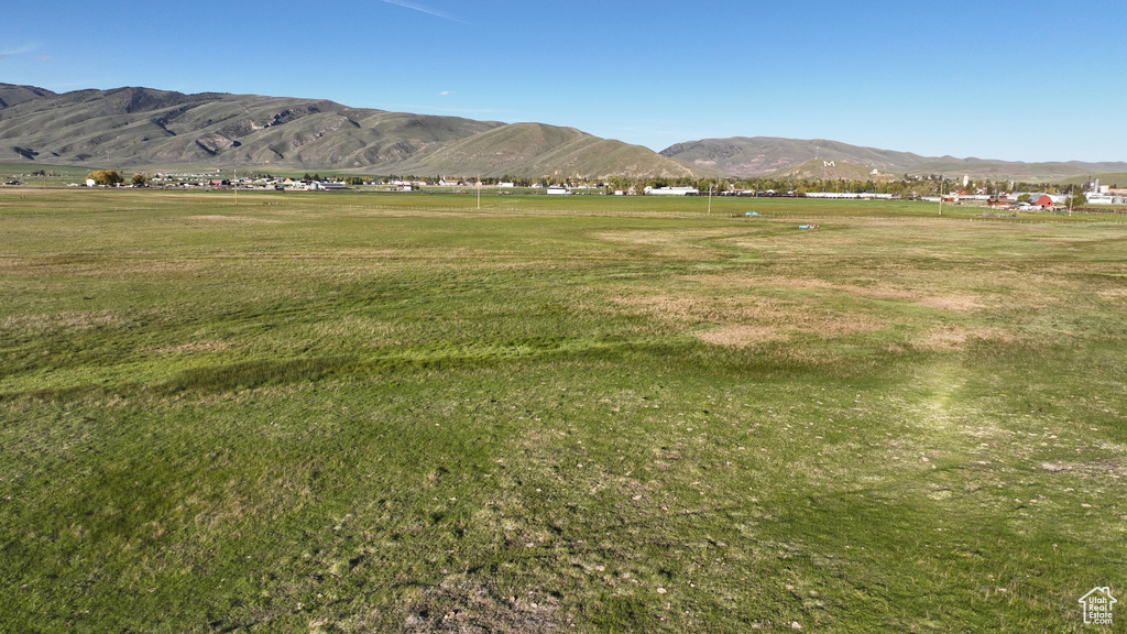 View of mountain backdrop with rural landscape