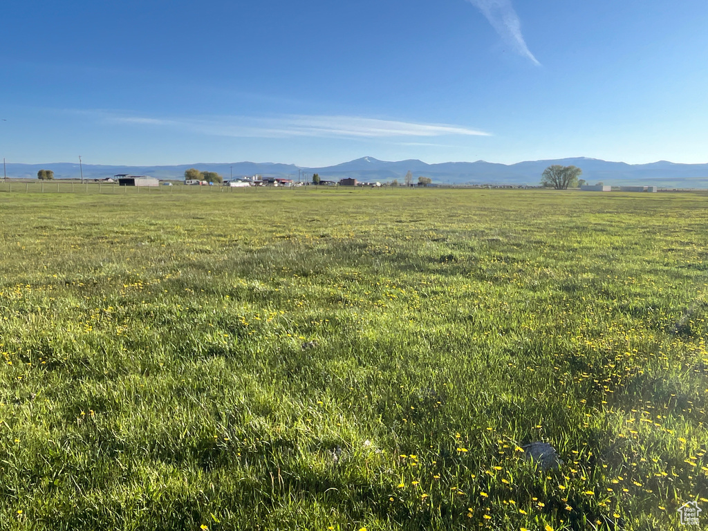 View of mountain backdrop featuring rural landscape