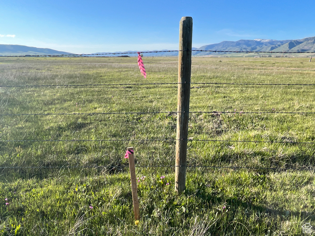 View of mountain backdrop with rural landscape