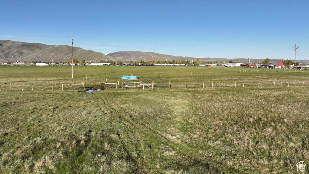 View of mountain backdrop with rural landscape