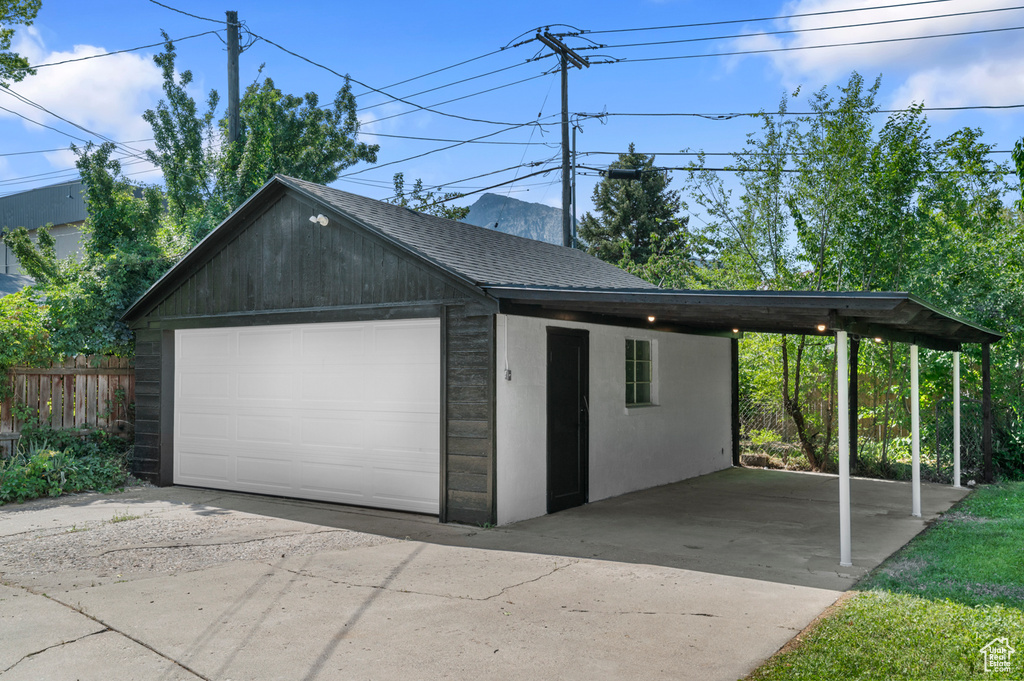 Garage featuring a detached garage