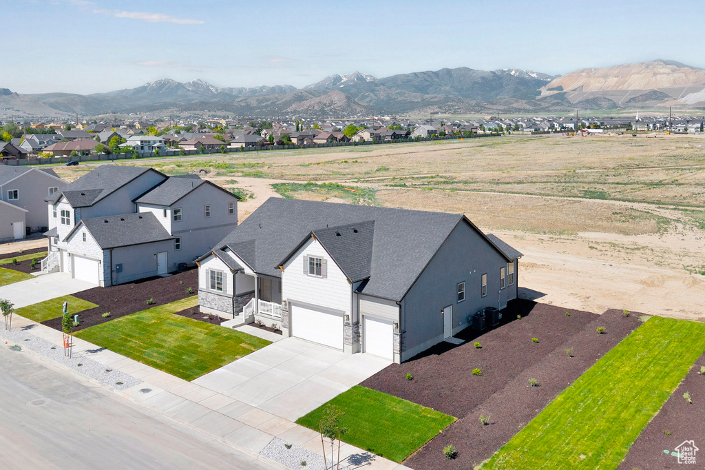 Aerial view of residential area with a mountainous background
