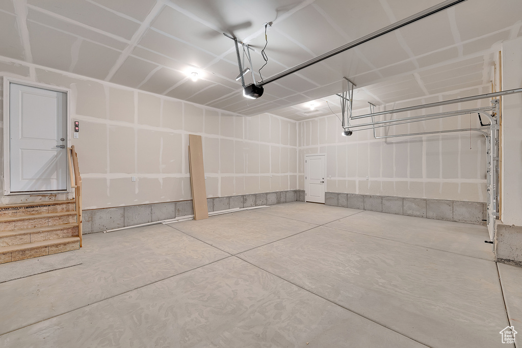Garage featuring a garage door opener